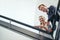 Lifes more fun from way up here. Low angle portrait of two coworkers leaning on a stairwell bannister.