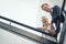 Lifes more fun from way up here. Low angle portrait of two coworkers leaning on a stairwell bannister.