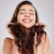 Lifes too short for unhealthy hair. Studio shot of a young woman with beautiful long hair.