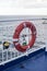 Lifesaver bouy on the railings at the side of a ship ferry