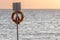 Lifesaver flotation ring. Beach lifebuoy ring on stand in front