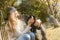 Lifestile outdoor portrait of young beautiful woman on natural b