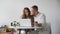 Lifestyle business couple sitting in office looking screen laptop happy working, small business