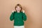 Lifestyle concept. Portrait of cheerful happy girl with joyful and exciting smiling isolated on beige background