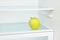 Lifestyle concept.Yellow apple in domestic refrigerator taken clo