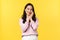 Lifestyle, emotions and advertisement concept. Adorable smiling asian woman looking shy and cute, touching her face with