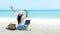 Lifestyle freelance woman listen music after using laptop working and relax on the beach.