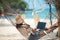 Lifestyle freelance woman using laptop working and relax on the beach