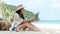 Lifestyle freelance woman using laptop working and relax on the beach