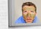 Lifestyle funny portrait of young attractive and surprised man horrified looking himself on bathroom mirror ugly and weird face ap