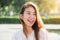 Lifestyle happy young adult asian woman smiling with teeth smile outdoors and walking on city street at sunset time.