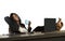 Lifestyle office portrait of young happy and attractive black afro American businesswoman with feet on computer desk smiling relax