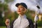 Lifestyle outdoors portrait of young beautiful and happy woman at playing golf holding ball and putter club smiling cheerful in st