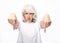 Lifestyle and people concept: gray hairy elderly woman looking angry and showing thumb down