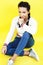 Lifestyle people concept: pretty young school teenage girl having fun happy smiling on yellow background close up