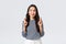 Lifestyle, people emotions and casual concept. Hopeful cute wishful asian girl cross fingers good luck, looking up at