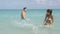Lifestyle people fun beach couple splashing water