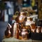 lifestyle photo iran stack of copper kettles outside shop