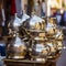 lifestyle photo iran stack of copper kettles outside shop