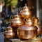 lifestyle photo iran stack of copper kettles outside shop