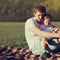 Lifestyle photo lovely father and son together resting outdoors