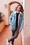 Lifestyle portrait of gen z teenage boy in denim jacket outdoors in empty street