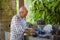 lifestyle portrait of senior happy and sweet Asian Japanese retired man cooking at home kitchen alone neat