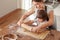 Lifestyle portrait of siblings baking cookies together.