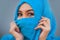 Lifestyle portrait young beautiful and happy Asian woman in hijab muslim head scarf covering face playful having fun smil
