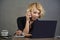 Lifestyle portrait of young stressed and messy business woman working at office laptop computer desk feeling tired and overwhelmed