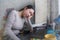 Lifestyle portrait of young stressed and worried Asian Japanese woman working from home or studying exam in stress at home office
