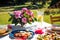 Lifestyle scene with Beautiful, colorful mediterranean table setup with flowers and food