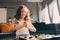 Lifestyle shot of smart kid girl playing checkers at home