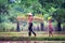 Lifestyle of Southeast Asian people in the field countryside Thailand ,Farther and son in rice fields after work and so happy.