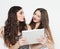 Lifestyle, tehnology and people concept: Two young female friends with digital tablet