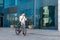 Lifestyle, transport, communication and people. Young man with bicycle and smartphone