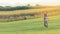 Lifestyle woman with bicycling at the garden meadow in sunset near mountain background