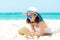 Lifestyle young  woman relax on the summer beach.  Asia tourism people reading and chill in holiday. blue sky background.