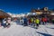 At a lift station in the mountains of the Dolomites. Skiers wait in line to take the cable car