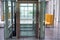 Lift with transparent glass doors in modern building