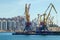 Lifting harbor cranes, shipping containers and granaries in the cargo seaport