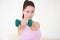 Lifting her way to physical fitness. Portrait of a serious-looking young woman lifting a dumbbell with one arm.