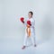 On a light background with an orange belt athlete stands in rack of a karate