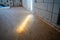 Light beam on an oriented strand board subfloor. The first leveling layer of OSB boards. Renovation process in a newly built