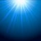 Light beams sparkling blue background