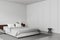 Light bedroom interior with bed and decor with shelf. Mockup wall