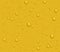 Light beer transparent drops of dew on yellow background