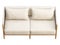 Light beige fabric sofa with pillow and plaid. 3d render