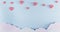 Light blue background with paper clouds and pink hearts. Valentine`s Day and baby birth background concept.