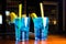 Light blue Cocktails stand on the table.